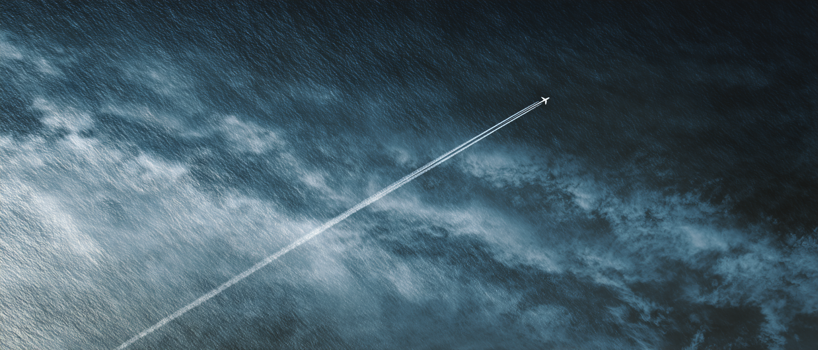 Aerial view of commercial aircraft over ocean