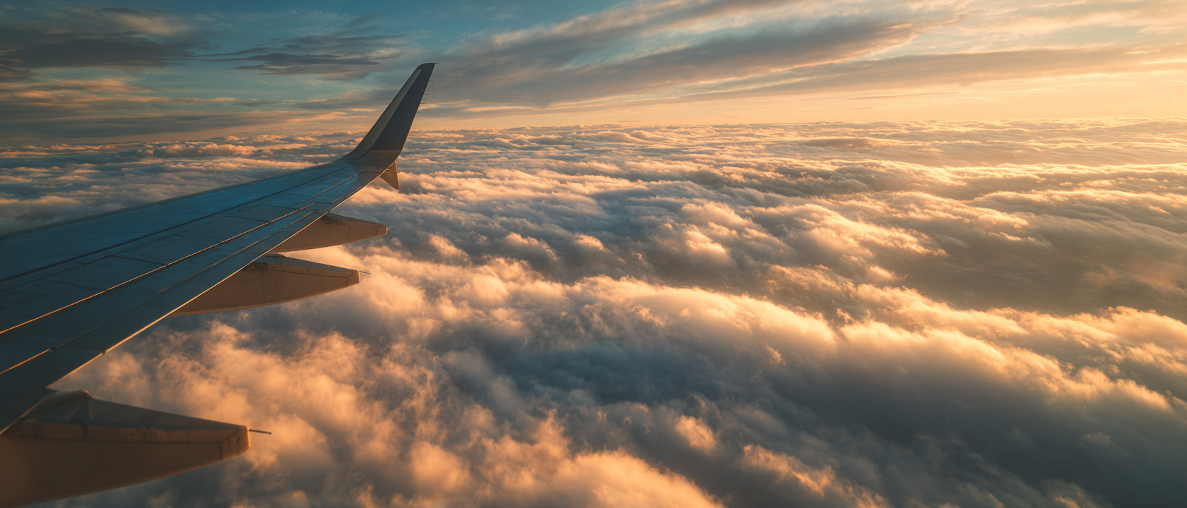 Aircraft cabin window with clouds — modernization programs by LB Aircraft Engineering